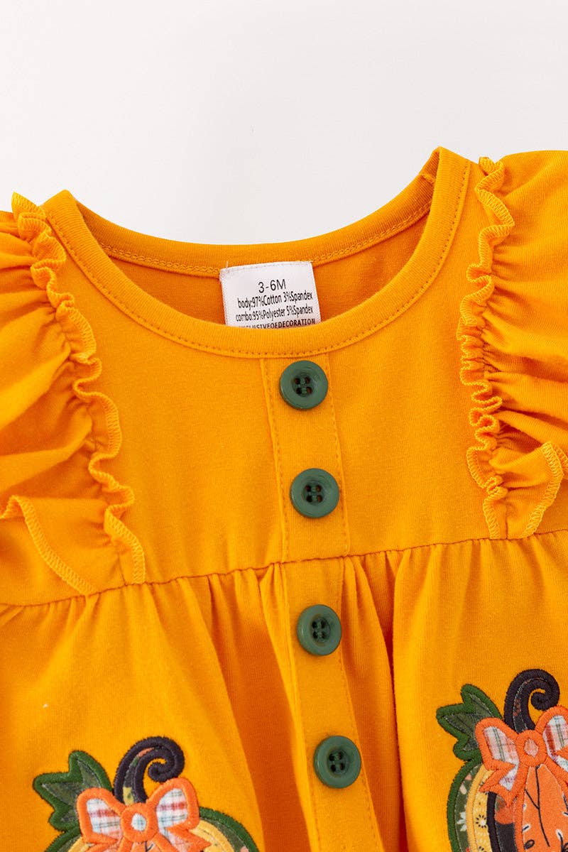 Pumpkin applique baby bodysuit with snaps.