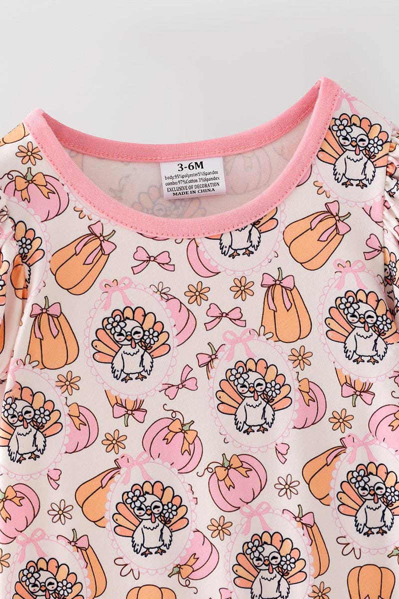Turkey & pumpkin printed romper w/ pink ruffle hem.