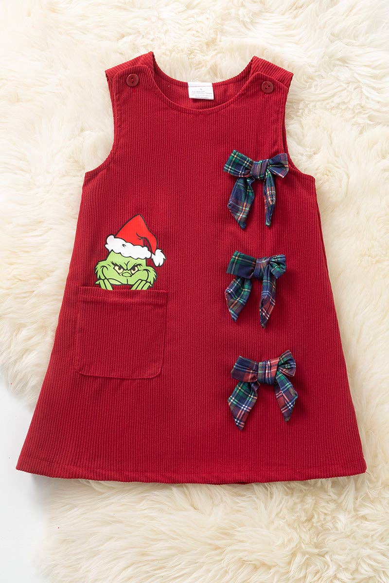 Grinc* corduroy dress with side pocket and bows.