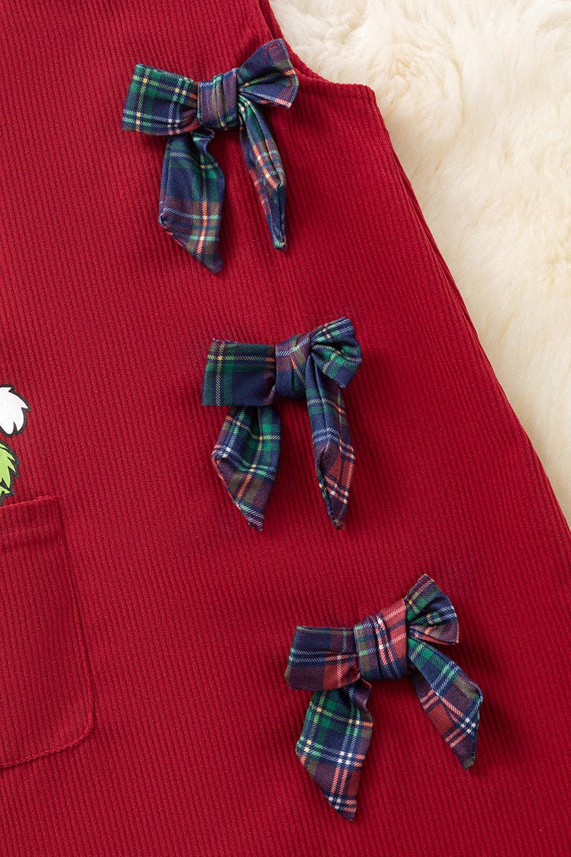Grinc* corduroy dress with side pocket and bows.