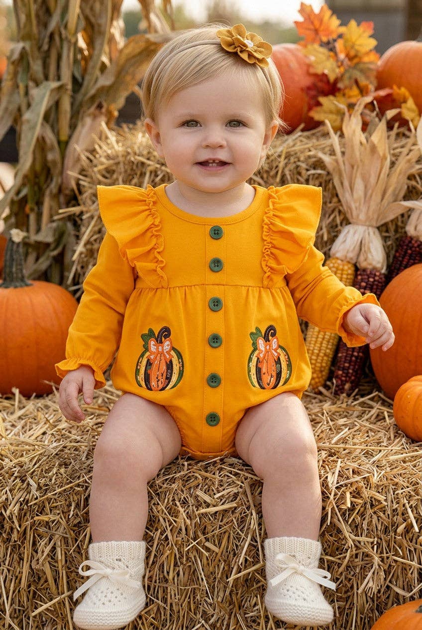 Pumpkin applique baby bodysuit with snaps.