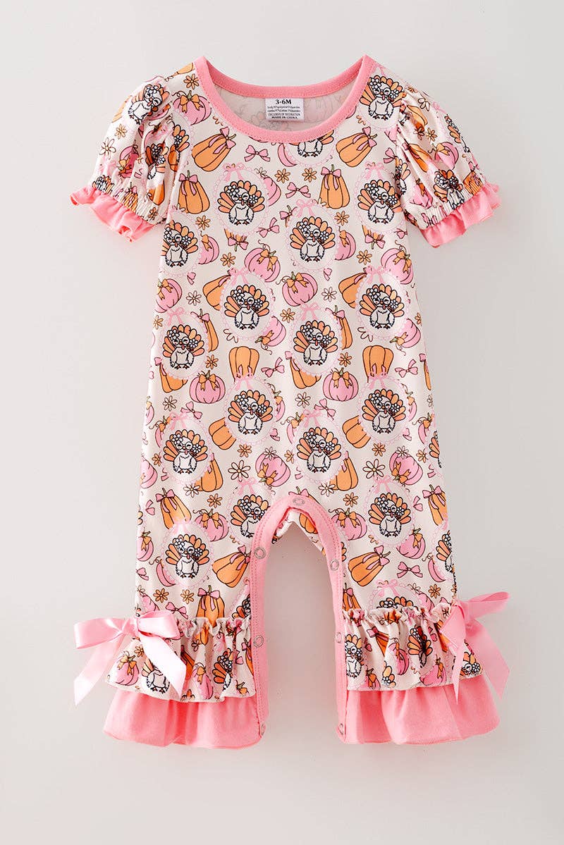 Turkey & pumpkin printed romper w/ pink ruffle hem.